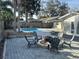 Backyard features an inviting pool area and an outdoor fire pit great for entertaining at 2929 Carriage Dr, South Daytona, FL 32119