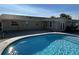 Inviting in-ground pool with cool blue water and brick-paved patio at 2929 Carriage Dr, South Daytona, FL 32119