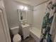 Cozy bathroom with a white vanity and shower-tub combination, great for relaxing at 305 Elsie Ave, Daytona Beach, FL 32117