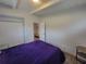Spacious bedroom with closet space, wood-look flooring, and bright natural light at 305 Elsie Ave, Daytona Beach, FL 32117