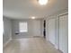 Bright, open room with tile flooring, storage closets, and a window offering natural light at 305 Elsie Ave, Daytona Beach, FL 32117