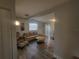 Cozy living room with comfortable seating, wood-look flooring, and neutral decor at 305 Elsie Ave, Daytona Beach, FL 32117