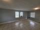 Bright living room with tile flooring and lots of natural light from multiple windows at 305 Elsie Ave, Daytona Beach, FL 32117
