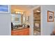 Bright bathroom with a shower and a vanity with granite countertop at 3051 S Atlantic Ave # 2206, Daytona Beach, FL 32118