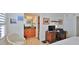 Bright bedroom with a bathroom, featuring a comfortable bed, and a workspace with computer at 3051 S Atlantic Ave # 2206, Daytona Beach, FL 32118