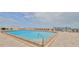 Community pool with plenty of lounge chairs and a view of the ocean at 3051 S Atlantic Ave # 2206, Daytona Beach, FL 32118