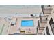Top-down view of the pool and outdoor lounge area of the condominium at 3051 S Atlantic Ave # 2206, Daytona Beach, FL 32118