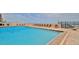 Community pool with plenty of lounge chairs and a view of the ocean at 3051 S Atlantic Ave # 2206, Daytona Beach, FL 32118