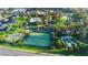 Aerial view showcasing community amenities: pool, tennis courts, shuffleboard at 3102 Cordgrass Ct, The Villages, FL 32163
