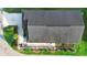Aerial view of the home showcasing its roof, patio, landscaped backyard, and proximity to the neighborhood at 3102 Cordgrass Ct, The Villages, FL 32163