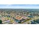 Aerial view of a residential community with numerous single-Gathering homes at 3102 Cordgrass Ct, The Villages, FL 32163