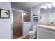 Modern bathroom featuring a glass-enclosed shower, stylish vanity, and updated fixtures at 3102 Cordgrass Ct, The Villages, FL 32163