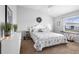 Cozy bedroom with soft, neutral colors, comfortable bedding, and a view of the outdoors at 3102 Cordgrass Ct, The Villages, FL 32163