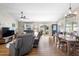 Bright open concept space with a seamlessly connected living room, dining area, and modern decor at 3102 Cordgrass Ct, The Villages, FL 32163