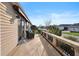 Serene patio area with a stone retaining wall, cozy seating, and a view of the neighborhood at 3102 Cordgrass Ct, The Villages, FL 32163