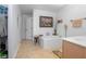 Bright bathroom featuring a large soaking tub, tiled flooring, and neutral decor at 3894 Arborvitae Way, Deland, FL 32724