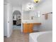 Bathroom featuring a soaking tub and double vanity with wood cabinets at 3894 Arborvitae Way, Deland, FL 32724