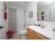 Bathroom with a modern shower-tub combination and tiled flooring at 3894 Arborvitae Way, Deland, FL 32724