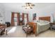 Bright bedroom with a ceiling fan, carpet, and stylish decor at 3894 Arborvitae Way, Deland, FL 32724