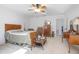 Bright bedroom with a ceiling fan, carpet, and stylish decor at 3894 Arborvitae Way, Deland, FL 32724