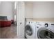 Functional laundry room featuring modern appliances and a practical layout for efficient chores at 3894 Arborvitae Way, Deland, FL 32724