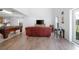 Bright living area with a pool table, comfortable seating, and a view of the backyard at 3894 Arborvitae Way, Deland, FL 32724