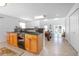 Open living area with a kitchenette and a pool table, leading to an expansive backyard at 3894 Arborvitae Way, Deland, FL 32724