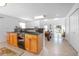 Open living area with a kitchenette and a pool table, leading to an expansive backyard at 3894 Arborvitae Way, Deland, FL 32724