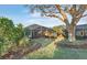 Beautiful backyard featuring mature landscaping, a screened lanai and stunning backyard views at 411 Foxhill Dr, Debary, FL 32713