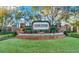 DeBary Golf & Country Club entrance sign with manicured landscaping and brick accents at 411 Foxhill Dr, Debary, FL 32713