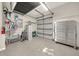 Well-organized garage space featuring ample storage, shelving, and a large mechanic's tool chest at 411 Foxhill Dr, Debary, FL 32713