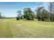 Expansive view of a well-maintained golf course featuring mature trees at 411 Foxhill Dr, Debary, FL 32713