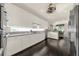 Well-lit kitchen with white cabinets, granite countertops, and stainless steel appliances at 411 Foxhill Dr, Debary, FL 32713