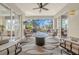 Covered patio with comfortable seating around a table and fire pit, perfect for outdoor enjoyment at 411 Foxhill Dr, Debary, FL 32713