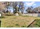 Spacious backyard with a shed and a privacy fence, ideal for outdoor activities at 4612 Reynosa Sw Dr, Winter Haven, FL 33880