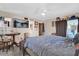 Bedroom featuring a ceiling fan, a large bed, an exterior entrance, and a TV on the wall at 4612 Reynosa Sw Dr, Winter Haven, FL 33880
