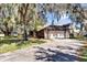 Exterior view of a home with a two-car garage, showcasing a concrete driveway and stone accents at 4612 Reynosa Sw Dr, Winter Haven, FL 33880