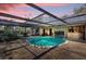 Relaxing covered pool area featuring a unique bar, clear water, and ample space for entertaining at 4612 Reynosa Sw Dr, Winter Haven, FL 33880