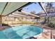 Refreshing pool with a screened enclosure, offering a perfect outdoor retreat at 4612 Reynosa Sw Dr, Winter Haven, FL 33880