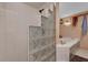 Bright shower stall featuring glass block partition near a soaking tub at 4612 Reynosa Sw Dr, Winter Haven, FL 33880