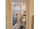 Modern bathroom featuring a glass-enclosed shower with a built-in seat and gray accent tile at 4670 Links Village Dr # B706, Ponce Inlet, FL 32127