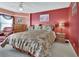 Inviting bedroom with a unique headboard, complemented by a matching bedspread and a warm color palette at 4670 Links Village Dr # B706, Ponce Inlet, FL 32127