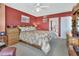 Comfortable bedroom with a cozy bed and wooden furnishings at 4670 Links Village Dr # B706, Ponce Inlet, FL 32127