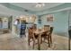 Dining room with seating for four with an adjacent bar and kitchen at 4670 Links Village Dr # B706, Ponce Inlet, FL 32127