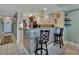 Kitchen with counter seating and stainless steel appliances at 4670 Links Village Dr # B706, Ponce Inlet, FL 32127