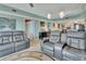 Comfortable living room with dual leather recliners and open access to kitchen at 4670 Links Village Dr # B706, Ponce Inlet, FL 32127