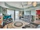 Living room featuring a large TV and a sliding glass door for accessing the outside area at 4670 Links Village Dr # B706, Ponce Inlet, FL 32127