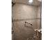 Tiled shower with a built-in grab bar at 4670 Links Village Dr # B706, Ponce Inlet, FL 32127