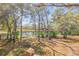 Beautiful backyard with pond views from the home's exterior at 49 Crooked Pine Rd, Port Orange, FL 32128