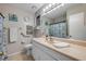 Bathroom featuring a large mirror, beige countertops, and neutral tones at 49 Crooked Pine Rd, Port Orange, FL 32128